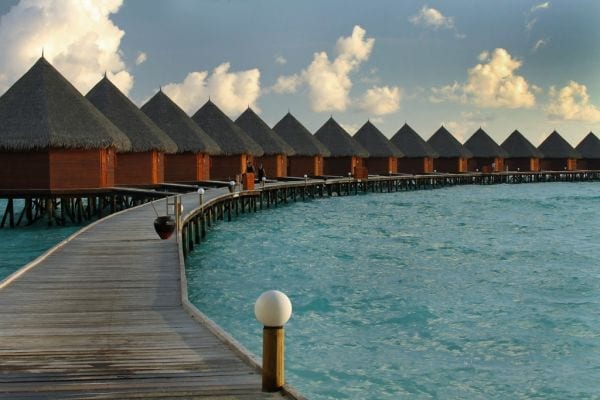 Stay in an overwater villa
